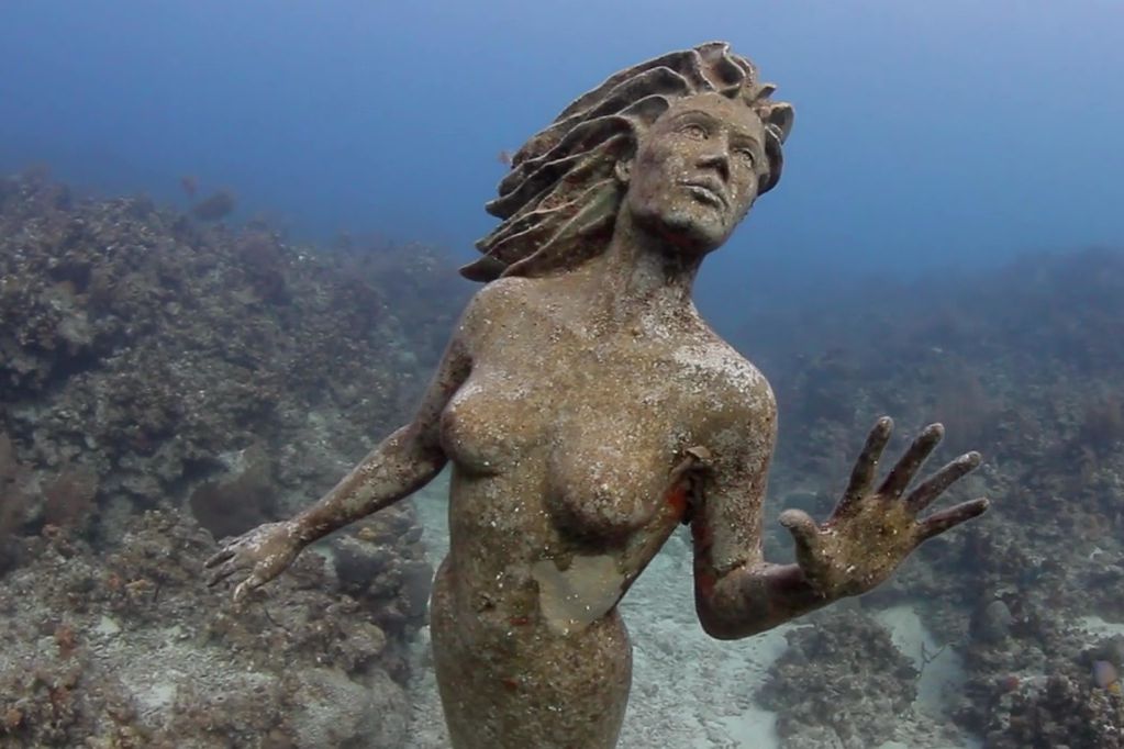 scary creepy underwater statues
