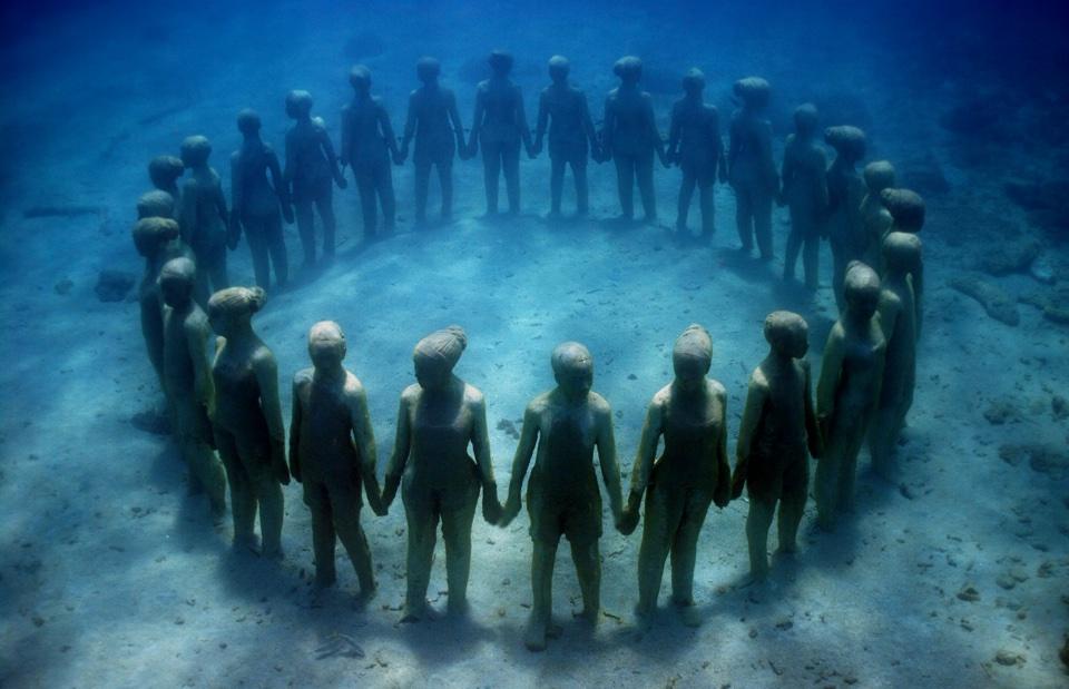 creepy underwater statues