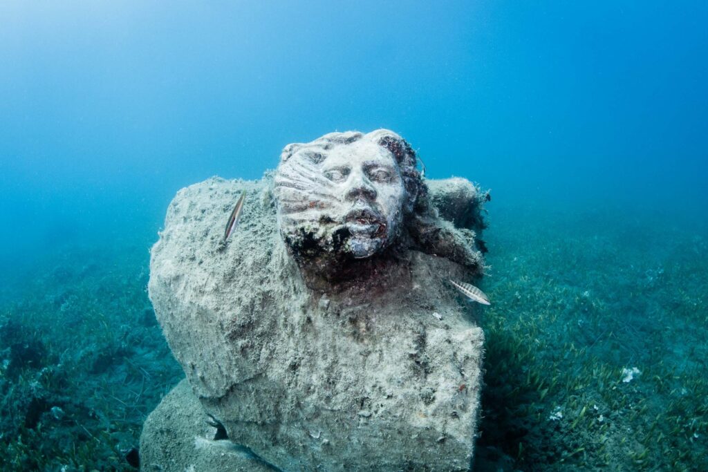 creepy underwater statues
